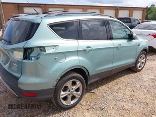 2013 Ford Escape SE with VIN 1FMCU9G99DUA86154, listed as a IAAI auction lot 42471002 with 168,075 mi miles and . Bid and sale history available at DreamBid. Image 4.