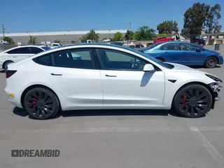 2022 Tesla Model 3 Performance with VIN 5YJ3E1ECXNF270238, listed as a IAAI auction lot 42173668 with 13,017 mi miles and . Bid and sale history available at DreamBid. Image 14.