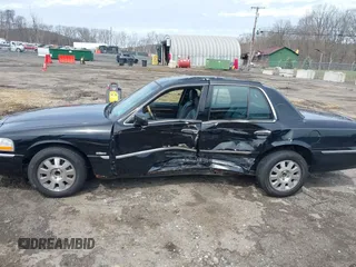 2005 Mercury Grand Marquis LS Premium z VIN 2MEFM75W65X671622, wystawiony jako IAAI lot #41958287 z przebiegiem 154 662 mil mil oraz . Historia ofert i sprzedaży dostępna na DreamBid. Obrazek 14.