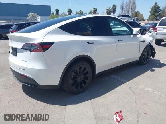 2023 Tesla Model Y Long Range with VIN 7SAYGDEE8PF612438, listed as a IAAI auction lot 41991145 with 29,775 mi miles and . Bid and sale history available at carsss.com. Image 4.