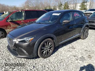 2016 Mazda CX-3 Grand Touring with VIN JM1DKBD7XG0107274, listed as a Copart auction lot 52137385 with 35,376 mi miles and Salvage Title. Bid and sale history available at carsss.com. Image 1.