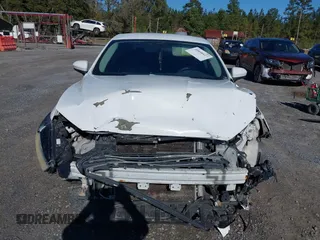 2014 Ford Fusion S with VIN 1FA6P0G71E5384783, listed as a IAAI auction lot 40868527 with 207,354 mi miles. Bid and sale history available at carsss.com. Image 6.