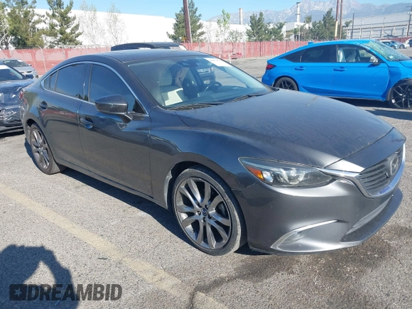 2017 Mazda 6 Grand Touring with VIN JM1GL1W51H1137470, listed as a IAAI auction lot 41872756 with 132,564 mi miles. Bid and sale history available at carsss.com. Image 1.