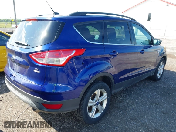 2014 Ford Escape SE with VIN 1FMCU9GX1EUB52373, listed as a IAAI auction lot 42163933 with 128,634 mi miles. Bid and sale history available at carsss.com. Image 4.