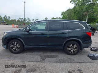 2017 Honda Pilot EX-L with VIN 5FNYF6H50HB033968, listed as a IAAI auction lot 42400720 with 119,597 mi miles and . Bid and sale history available at DreamBid. Image 14.