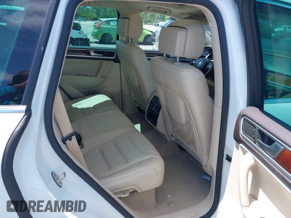 2012 Volkswagen Touareg Sport with VIN WVGEF9BP1CD008717, listed as a IAAI auction lot 42120641 with 211,580 mi miles and . Bid and sale history available at DreamBid. Image 8.