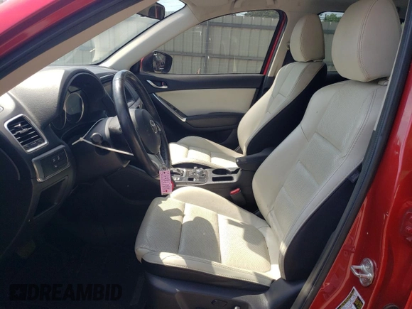 2016 Mazda CX-5 Grand Touring z VIN JM3KE2DY0G0722334, wystawiony jako Copart lot #59998185 z przebiegiem 51 449 mil mil oraz Szkoda całkowita • Salvage title. Historia ofert i sprzedaży dostępna na DreamBid. Obrazek 7.