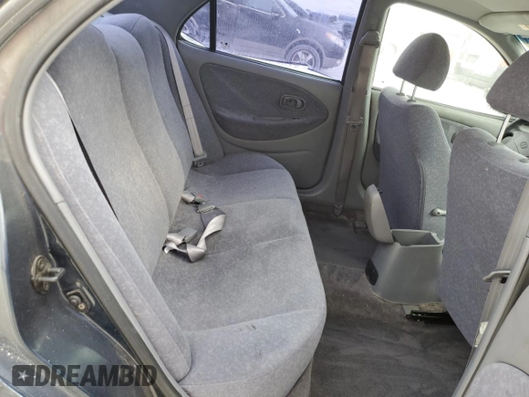 2000 Hyundai Elantra GLS z VIN KMHJF35F9YU032902, wystawiony jako Copart lot #45145955 z przebiegiem 79 229 mil mil oraz Czysty tytuł • Clean title. Historia ofert i sprzedaży dostępna na DreamBid. Obrazek 10.
