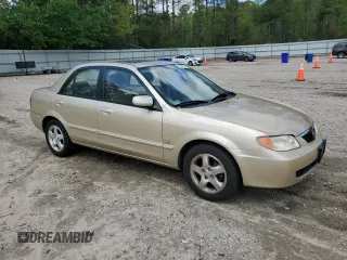 2001 Mazda Protege LX with VIN JM1BJ225810473897, listed as a Copart auction lot 52192045 with 145,839 mi miles and Salvage Title. Bid and sale history available at carsss.com. Image 4.