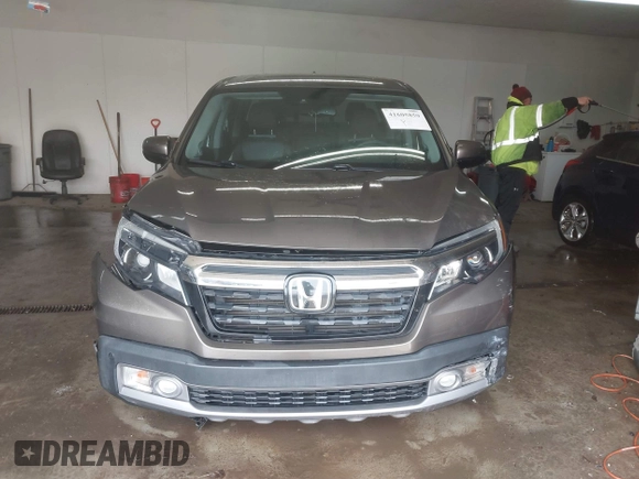 2020 Honda Ridgeline RTL-E with VIN 5FPYK3F75LB001516, listed as a IAAI auction lot 41605859 with 93,902 mi miles and . Bid and sale history available at DreamBid. Image 12.