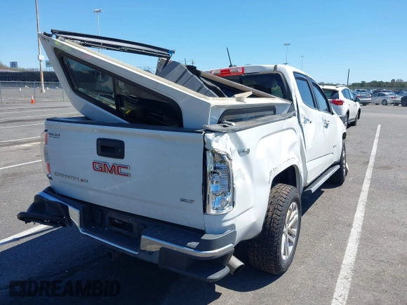 2018 GMC Canyon 4WD SLT z VIN 1GTG6DEN1J1146038, wystawiony jako IAAI lot #42069492 z przebiegiem 63 316 mil mil oraz . Historia ofert i sprzedaży dostępna na DreamBid. Obrazek 4.