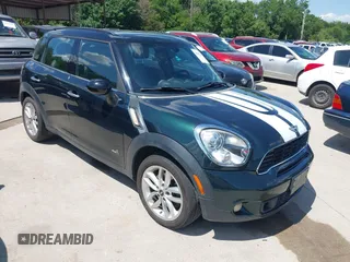 2011 MINI Countryman S with VIN WMWZC5C53BWM10484, listed as a IAAI auction lot 42250690 with 113,534 mi miles and . Bid and sale history available at DreamBid. Image 1.