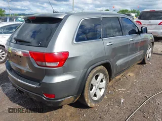 2011 Jeep Grand Cherokee Overland Summit with VIN 1J4RR6GT3BC713812, listed as a IAAI auction lot 42398585 with 208,476 mi miles and . Bid and sale history available at DreamBid. Image 4.