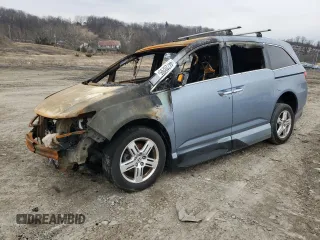 2012 Honda Odyssey Touring with VIN 5FNRL5H92CB127191, listed as a Copart auction lot 44720295 with Not Provided miles and Salvage Title. Bid and sale history available at DreamBid. Image 1.