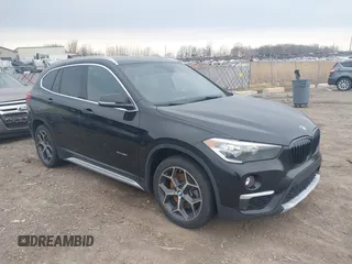 2016 BMW X1 xDrive28i with VIN WBXHT3C37G5E48434, listed as a IAAI auction lot 42005591 with 140,066 mi miles. Bid and sale history available at carsss.com. Image 1.