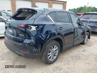2023 Mazda CX-5 S Carbon Edition z VIN JM3KFBCM6P0251947, wystawiony jako IAAI lot #42286595 z przebiegiem 9 434 mil mil oraz . Historia ofert i sprzedaży dostępna na DreamBid. Obrazek 4.
