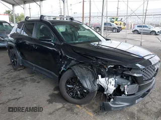 2025 Mazda CX-50 S Premium z VIN 7MMVABDM2SN316498, wystawiony jako IAAI lot #42032239 z przebiegiem Nie podano mil oraz . Historia ofert i sprzedaży dostępna na DreamBid. Obrazek 1.