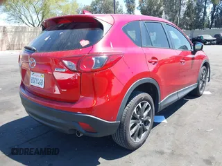 2016 Mazda CX-5 Grand Touring z VIN JM3KE2DY2G0660385, wystawiony jako IAAI lot #42101004 z przebiegiem 166 336 mil mil oraz . Historia ofert i sprzedaży dostępna na DreamBid. Obrazek 4.