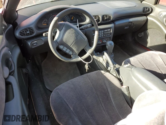 1998 Pontiac Sunfire z VIN 4G2JB32T7WB202549, wystawiony jako Copart lot #75095294 z przebiegiem 38 312 mil mil oraz Szkoda całkowita • Salvage title. Historia ofert i sprzedaży dostępna na DreamBid. Obrazek 8.