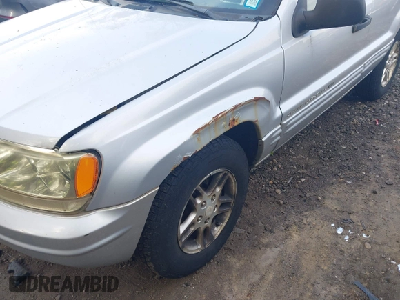 2002 Jeep Grand Cherokee Laredo z VIN 1J4GW48S62C261154, wystawiony jako IAAI lot #42602424 z przebiegiem 160 295 mil mil oraz . Historia ofert i sprzedaży dostępna na DreamBid. Obrazek 6.