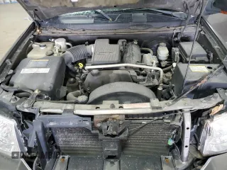 2005 GMC Envoy SLT z VIN 1GKDT13S652287033, wystawiony jako Copart lot #52508925 z przebiegiem 170 434 mil mil oraz Szkoda całkowita • Salvage title. Historia ofert i sprzedaży dostępna na DreamBid. Obrazek 13.
