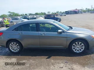 2012 Chrysler 200 Touring with VIN 1C3CCBBGXCN326023, listed as a IAAI auction lot 42126529 with 163,325 mi miles and . Bid and sale history available at carsss.com. Image 13.