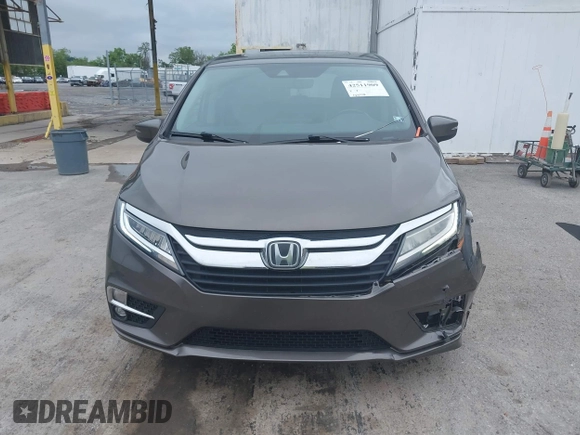 2018 Honda Odyssey Touring with VIN 5FNRL6H89JB057148, listed as a IAAI auction lot 42511909 with 166,438 mi miles and . Bid and sale history available at DreamBid. Image 12.