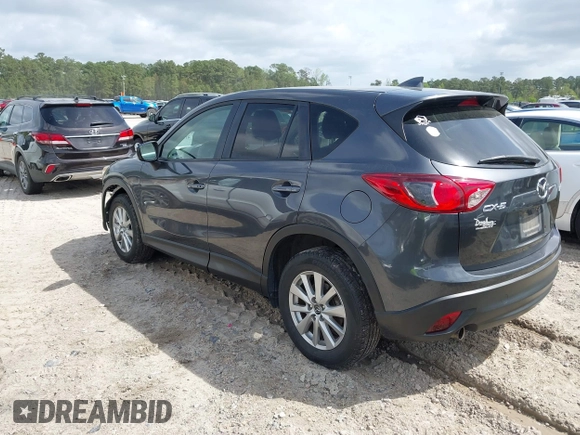 2016 Mazda CX-5 Touring with VIN JM3KE2CYXG0647921, listed as a IAAI auction lot 41948068 with 133,733 mi miles and . Bid and sale history available at DreamBid. Image 3.