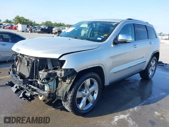 2013 Jeep Grand Cherokee Overland with VIN 1C4RJECG9DC545886, listed as a IAAI auction lot 41998913 with 166,077 mi miles. Bid and sale history available at carsss.com. Image 2.