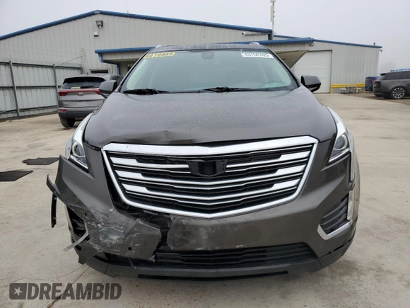 2019 Cadillac XT5 Luxury FWD with VIN 1GYKNCRSXKZ141831, listed as a Copart auction lot 43758765 with 97,402 mi miles and Salvage Title. Bid and sale history available at DreamBid. Image 5.