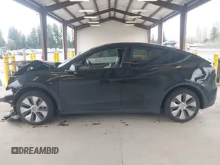 2023 Tesla Model Y Long Range with VIN 7SAYGDEE0PF909610, listed as a IAAI auction lot 41906081 with 20,656 mi miles and . Bid and sale history available at DreamBid. Image 15.