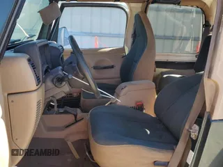 2002 Jeep Wrangler Sahara with VIN 1J4FA59S02P761365, listed as a Copart auction lot 81899144 with 208,429 mi miles and Salvage title. Bid and sale history available at DreamBid. Image 7.