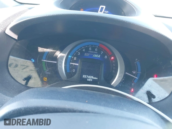 2010 Honda Insight EX with VIN JHMZE2H74AS012517, listed as a IAAI auction lot 41886588 with 227,428 mi miles and . Bid and sale history available at DreamBid. Image 7.