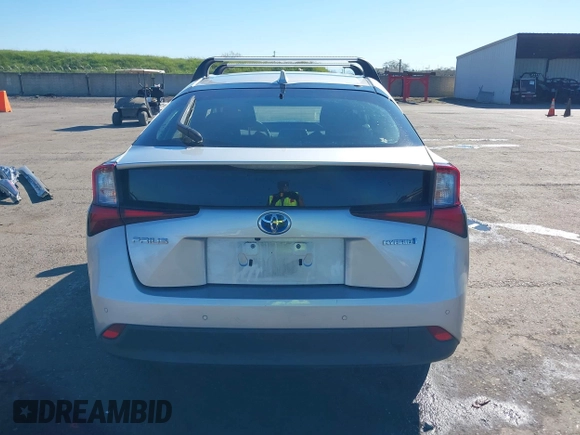 2021 Toyota Prius L Eco with VIN JTDKAMFU5M3130478, listed as a IAAI auction lot 41867606 with 52,223 mi miles. Bid and sale history available at carsss.com. Image 17.