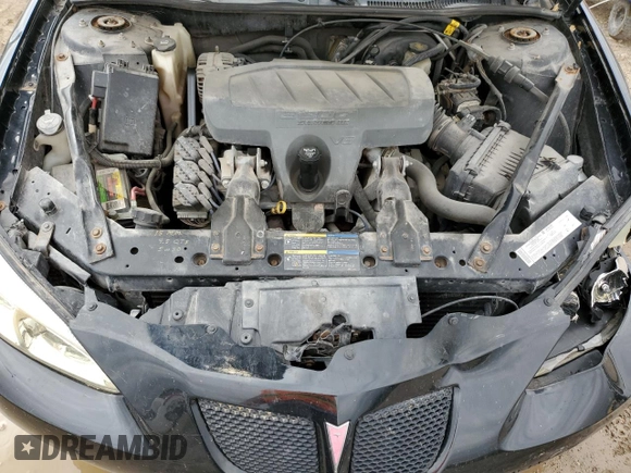 2005 Pontiac Grand Prix z VIN 2G2WP522451353570, wystawiony jako Copart lot #54862415 z przebiegiem 221 492 mil mil oraz Szkoda całkowita • Salvage title. Historia ofert i sprzedaży dostępna na DreamBid. Obrazek 11.