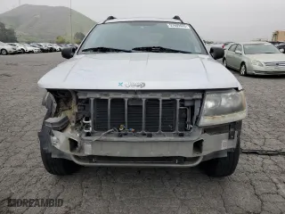 2004 Jeep Grand Cherokee Laredo with VIN 1J4GX48S64C151124, listed as a Copart auction lot 52669445 with 152,970 mi miles and Salvage Title. Bid and sale history available at carsss.com. Image 5.