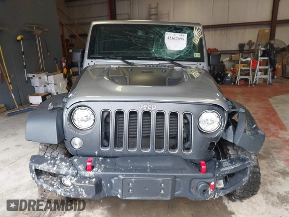 2017 Jeep Wrangler Unlimited Rubicon Recon z VIN 1C4BJWFG5HL687757, wystawiony jako IAAI lot #42367095 z przebiegiem 48 441 mil mil oraz . Historia ofert i sprzedaży dostępna na DreamBid. Obrazek 12.
