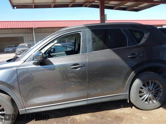 2021 Mazda CX-5 Touring with VIN JM3KFACM2M1313750, listed as a IAAI auction lot 41762938 with 68,503 mi miles. Bid and sale history available at carsss.com. Image 14.