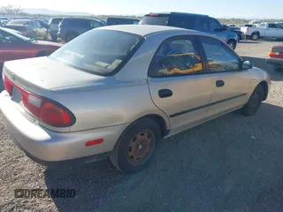1997 Mazda Protege DX with VIN JM1BC1412V0155780, listed as a IAAI auction lot 42134286 with Not Provided miles and . Bid and sale history available at DreamBid. Image 4.
