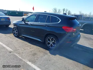 2018 BMW X1 xDrive28i with VIN WBXHT3C36J5F91110, listed as a IAAI auction lot 41757293 with 80,327 mi miles. Bid and sale history available at carsss.com. Image 3.