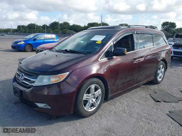 2011 Honda Odyssey Touring with VIN 5FNRL5H97BB008759, listed as a IAAI auction lot 41567010 with 215,709 mi miles. Bid and sale history available at carsss.com. Image 2.