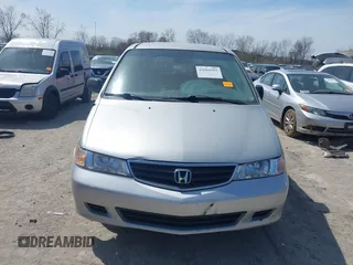 2002 Honda Odyssey LX z VIN 2HKRL18532H567409, wystawiony jako IAAI lot #42069502 z przebiegiem 173 662 mil mil oraz . Historia ofert i sprzedaży dostępna na DreamBid. Obrazek 13.