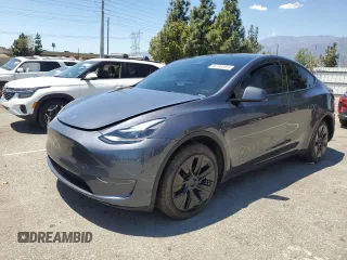 2024 Tesla Model Y Long Range with VIN 7SAYGDEEXRA215975, listed as a Copart auction lot 56705585 with 20,554 mi miles and Salvage Title. Bid and sale history available at DreamBid. Image 1.