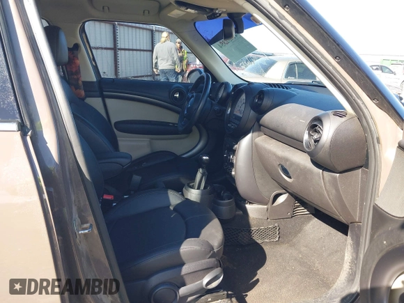 2014 MINI Countryman S with VIN WMWZC3C5XEWP52054, listed as a IAAI auction lot 41452354 with 104,873 mi miles and . Bid and sale history available at DreamBid. Image 5.