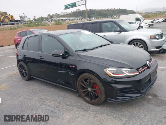 2019 Volkswagen Golf GTI S with VIN 3VW5T7AU3KM005648, listed as a IAAI auction lot 42096528 with 57,352 mi miles. Bid and sale history available at carsss.com. Image 1.