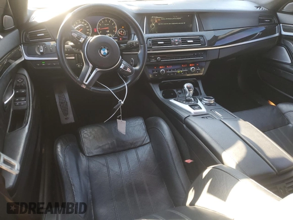 2014 BMW M5 z VIN WBSFV9C55ED593760, wystawiony jako Copart lot #49070765 z przebiegiem 128 365 mil mil oraz Tytuł czysty. Historia ofert i sprzedaży dostępna na DreamBid. Obrazek 8.