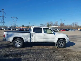 2009 Toyota Tacoma z VIN 5TEMU52N99Z621200, wystawiony jako IAAI lot #41318515 z przebiegiem 157 034 mil mil oraz . Historia ofert i sprzedaży dostępna na DreamBid. Obrazek 13.