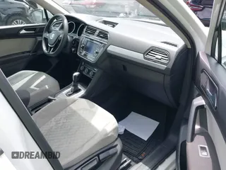 2018 Volkswagen Tiguan S with VIN 3VV1B7AX8JM032990, listed as a IAAI auction lot 42279807 with 74,185 mi miles and . Bid and sale history available at DreamBid. Image 5.