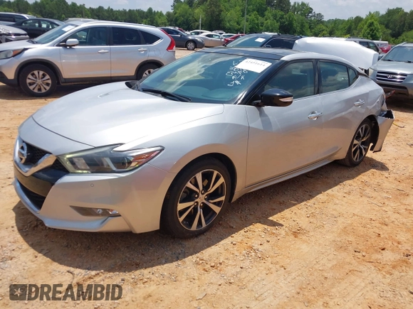 2016 Nissan Maxima SR with VIN 1N4AA6AP7GC389606, listed as a IAAI auction lot 42451614 with 114,957 mi miles and . Bid and sale history available at DreamBid. Image 2.