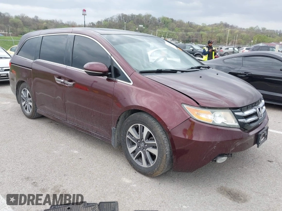 2014 Honda Odyssey Touring with VIN 5FNRL5H94EB127695, listed as a IAAI auction lot 41936109 with 221,786 mi miles and . Bid and sale history available at DreamBid. Image 1.